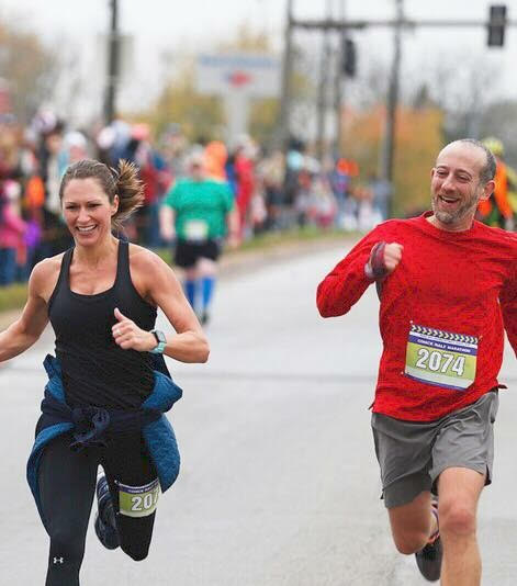 How much does exercise impact our mental health? Paul and I sprinting to the finish line of a half marathon, both of us smiling and laughing. It's obvious that running is good for my mental health. 